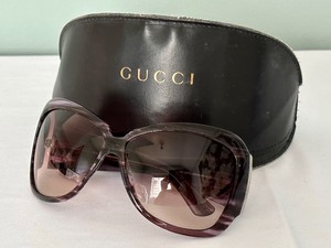 lot 28 image: Gucci Sunglasses with Case