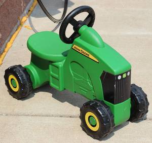 lot 60 image: ERTL Tomy John Deer Sit n Scoot Ride On Toy Tractor