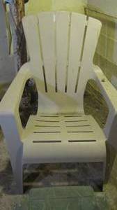 lot 79 image: Tan Heavy duty plastic outdoor chair