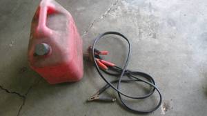 lot 131 image: Plastic 5 gallon gas can and jumper cables