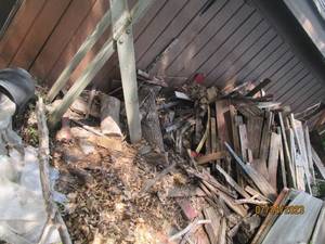 lot 236 image: Woodpile stand with contents