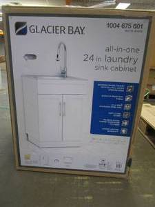 lot 27 image: Glacier Bay All-in-One Stainless Steel 24 in Laundry Sink with Faucet and Storage Cabinet in White - SCRATCH AND DENT, CRACKS IN SIDE WALL BY HINGE - FOR PARTS OR RESTORE - SOLD AS IS