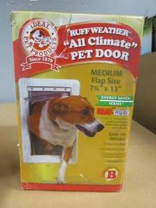 lot 218 image: Ideal Pet Products 7.25 in. x 13 in. Medium Ruff Weather Frame with Dual Flaps Dog and Pet Door Mount Door