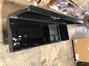 lot 41 image: Husky 71.36 in. Matte Black Aluminum Full Size Crossbed Truck Tool Box  Customer Returns See Pictures