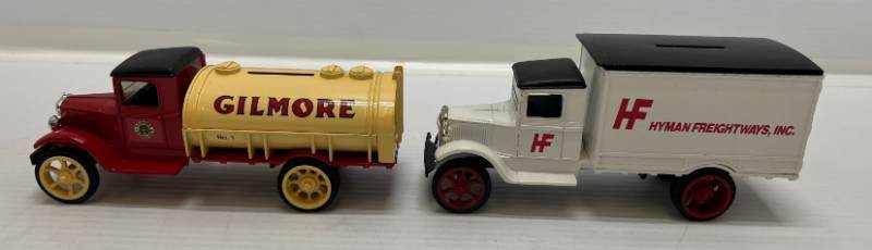 lot 21 image: Two Ertl Collectibles Die-Cast Metal Banks 1 1990  ( Hyman Freightways ) 1 1991 ( Gilmore Gasoline ) 1931 Hawkeye Tanker