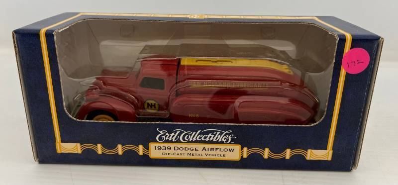 lot 23 image: Two Ertl Collectibles Die-Cast Metal Banks 1 1995 ( New Holland Machine Co.) 1931 Hawkeye Truck 1 1996 ( New Holland Lubricants ) 1939 Dodge Airflow