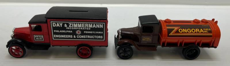 lot 26 image: Two 1990 Ertl Collectibles Die-Cast Metal Banks 1 (  Zongora Fuels Inc. ) 1931 Hawkeye Tanker 1  ( Day & Zimmerman ) 1931 Hawkeye Motor Truck