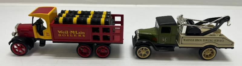 lot 31 image: Two Ertl Collectibles Die-Cast Metal Banks ( No Boxes ) 1 ( Warner Brothers )  1931 Hawkeye 1 ( Weil- McLain ) Kenworth