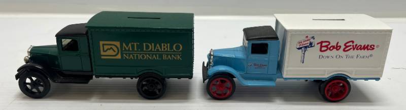 lot 39 image: Two 1995 Ertl Collectibles Die-Cast Metal Banks 1 ( Mt. Diablo) 1931 Hawkeye Truck 1 ( Bob Evans ) 1931 Hawkeye Truck