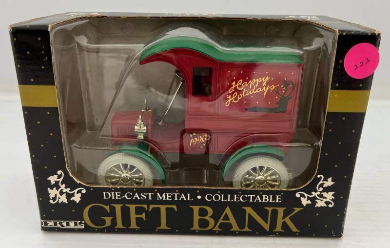 lot 72 image: Two Ertl Collectibles Die-Cast Metal Banks 1 1990 ( Happy Holidays ) Gift Bank 1 1994 ( Merry Christmas ) 1925 Kenworth Delivery Truck