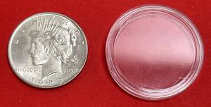 lot 185 image: 1923 Peace Dollar In Plastic Holder (Grerat Condition)