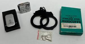 lot 205 image: Vintage Lighters & Handcuffs