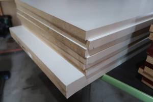 lot 23 image: STACK OF PRESS BOARD SHELVES