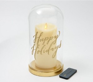 lot 630 image: Luminara Large Glass Cloche with 7 Pillar Candle and Remote - Happy Holidays
