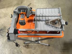 lot 7 image: RIDGID 9 Amp Corded 7 in. Wet Tile Saw with Stand Customer Returns See Pictures