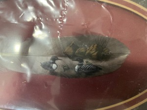 picture of loons painted on a feather