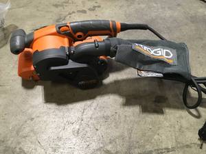 lot 48 image: RIDGID 6.5 Amp Corded 3 in.W x 18 in.L Heavy-Duty Variable Speed Belt Sander with AIRGUARD Technology  Customer Returns See Pictures