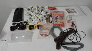 lot 182 image: Hand warmers, ear plugs, Scent absorb pack, Gun cleaner, Multi sharpener, Sunglasses Eye protection.