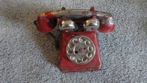 lot 202 image: Medal top toy, Telephone. Wooden toy