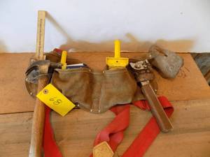 lot 68 image: Leather tool belt, Tape measure, Hammer, Stapler, String