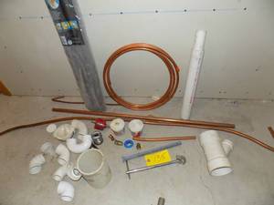 lot 135 image: Lot of Copper pipe,  wrench,  bender,  soft and ridged copper,  insulation,  PVC fitting  faucet wrench