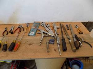 lot 148 image: Crescent wrench,  Sockets,  Screw Drivers,  Files,  Pliers,  Pry Bar,  Vise grips,  Needle Nose pliers