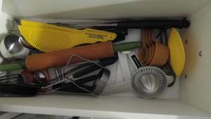 lot 233 image: Drawer full of cooking utensils, Ladles, forks, rolling pin.