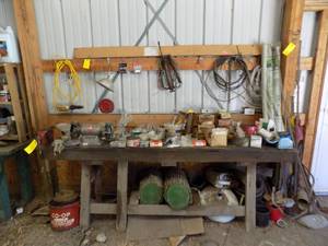 lot 487 image: Bench and everything on it Milwaukee Vice, Wessota bench grinder, Shop light, Large lot of hardware