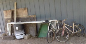 lot 498 image: Misc boards, Downspouts, 55 gal barrel, Misc plywood