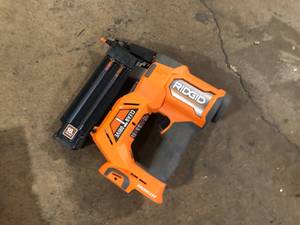 lot 33 image: RIDGID 18V Brushless Cordless 18-Gauge 2-18 in. Brad Nailer (Tool Only) with CLEAN DRIVE Technology  Customer Returns See Pictures
