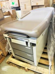 lot 48 image: MSRP $2500 UMF Examination Table with Stirrups, Pull Out Step Stool and Drawers - Good Condition - No Tears To Upholstery