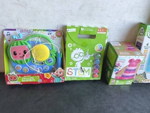 lot 125 image: LOT OF 5 Toys - CoComelon My First Sing-Along Boombox, STEM Fosters Innovation, Disney Baby Minnie Mouse Stacker, CHUCKLE & ROAR Magnetic Dot Art and Leap Frog Touch & Learn World Map