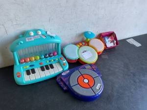 lot 131 image: LOT OF 4 TOYS - Nerf, Our Generation, Piano and Drums