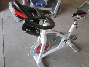 lot 6 image: Schwinn Carbon Blue spin bike with ...