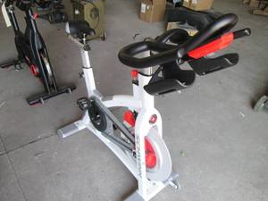 lot 7 image: Schwinn Carbon Blue spin bike with ...