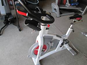 lot 8 image: Schwinn Carbon Blue spin bike with ...