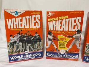 lot 101 image: Three Twins 1987 And 1991 World Champions Wheaties Boxes