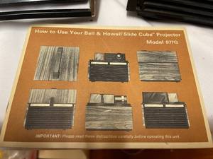 lot 114 image: Two Vintage Bell and Howell Slide Projectors with Cases