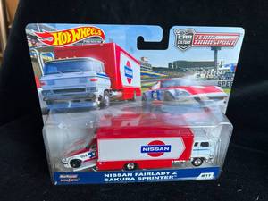 lot 45 image: Lot of 4 Team Transport Hot Wheels - New in Box