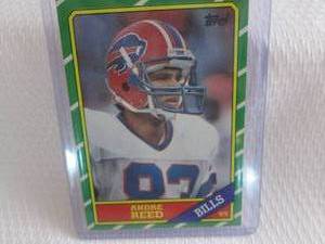 lot 120 image: 1986 Topps Andre Reed Rookie Card...