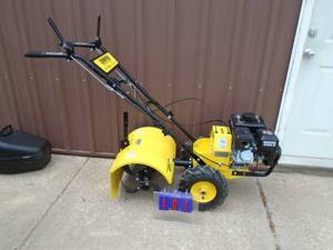 Champion rear tine tiller. Looks used once. THIS ITEM HAS A RESERVE.