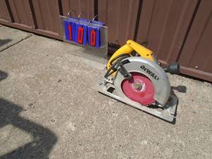 lot 100 image: Dewalt 7 14 circular saw. 110 volt. Nice shape. Tested & works. As shown.