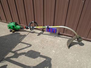 lot 111 image: John Deere curved shaft weed trimmer. Used condition. As shown.