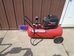 lot 115 image: Craftsman 150 psi air compressor. 15 gal tank. Used condition. Tested & works. As shown.