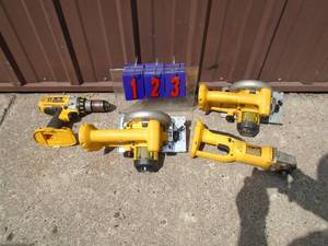 lot 123 image: Dealt 18 volt grinder, 2 saws & drill. No battery or charger. As shown.