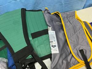 lot 12 image: Large Lot of Various Patient Lift Slings (Hoyer, Drive Medical, Sunrise Medical, Etc.) - All Look To Be In Great Condition