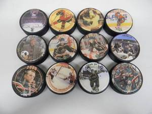 lot 8 image: RARE - VINTAGE EARLY 2000s MINNESOTA WILD COLLECTORS PUCKS - 11 RARE PUCKS - VERY NICE - GREAT PIECES - SEE PICTURES
