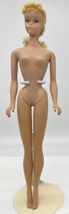 lot 23 image: Vintage 1960s #4 PONYTAIL Barbie Lemon Blonde Blue Eyes Light Blue Eyeliner Green Ears