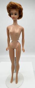 lot 68 image: Vintage 1963 BUBBLE CUT Barbie Titan Red Hair Big Red Lips marked JAPAN