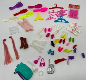 lot 190 image: Vintage Lot of Barbie Accessories - Shoes, Brushes, Hangers, Purses, & Gloves